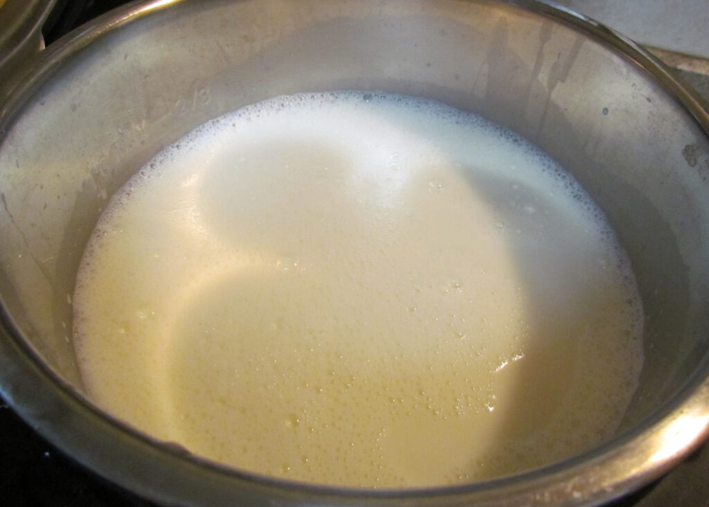 Milk poured into the Instant Pot insert prior to turning on the Instant Pot for the initial boil.